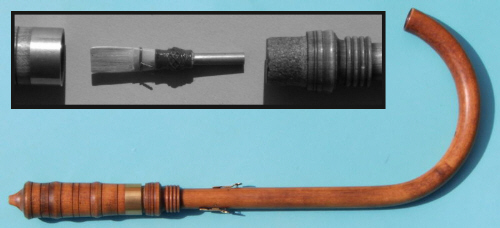 A modern F alto crumhorn, with an exploded view of the cap and reed